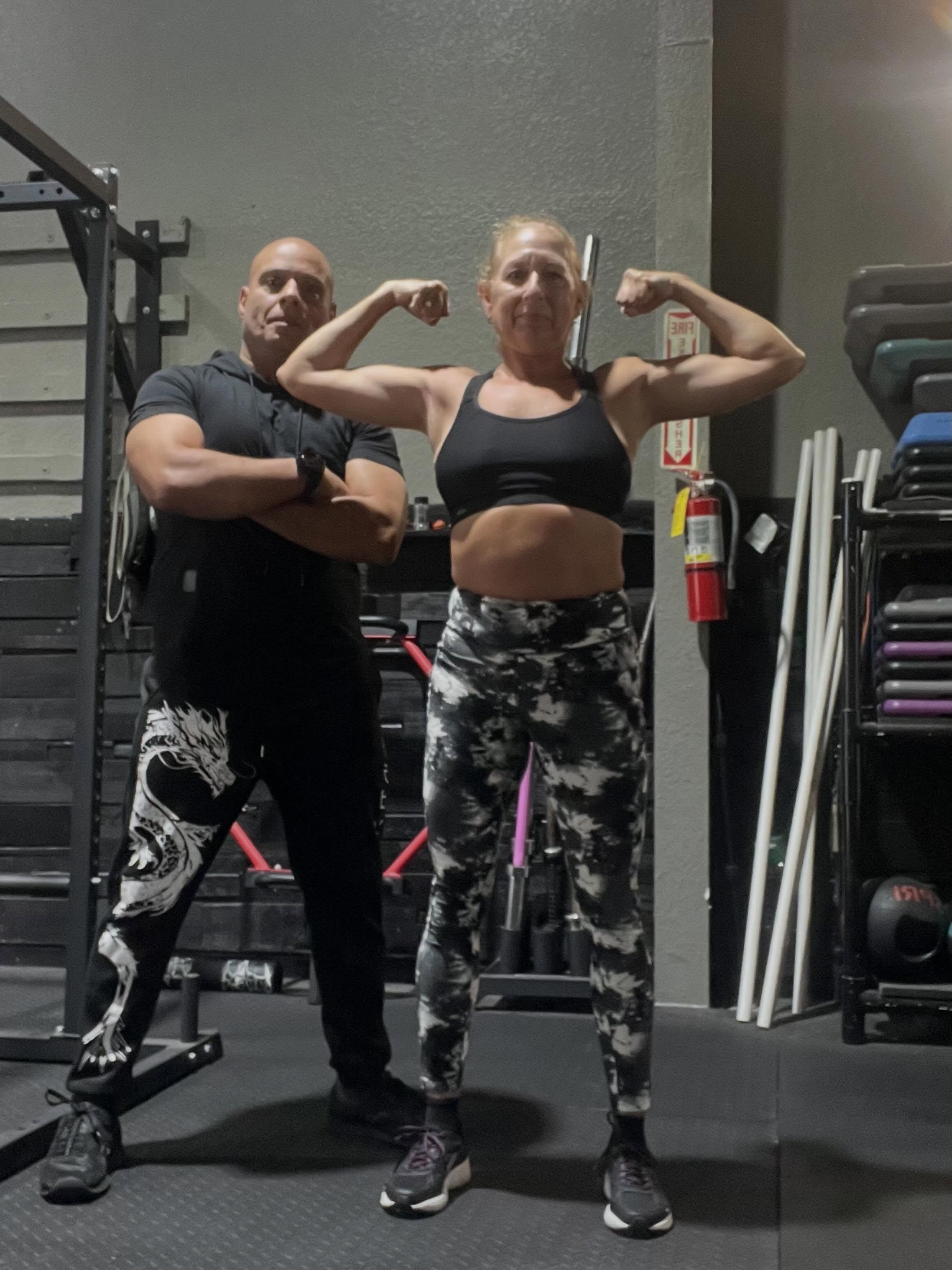 Coach Arqui training with a member